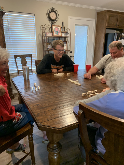 Brett playing dominos with the family. Memaw won!! :)
It got a little competitive.  