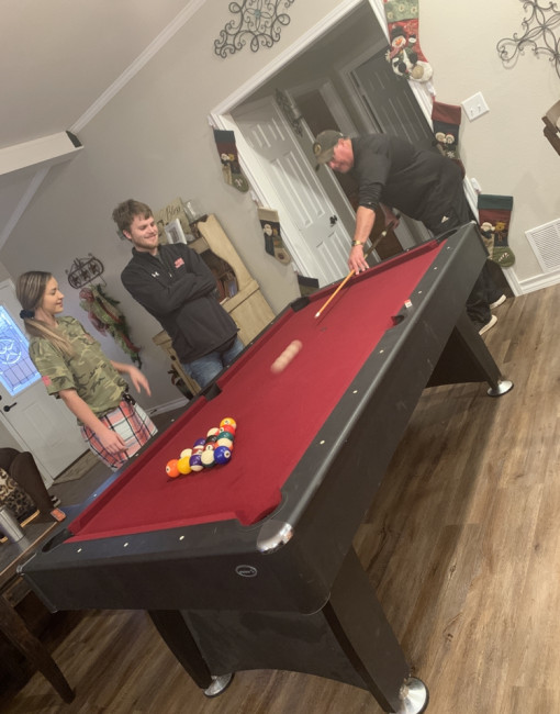 New pool table. He was so excited they just had to set it up in the living room. 